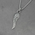 Full crystal pavé feather wing pendant necklace with silver box chain on grey background - Pendant + Matching Chain