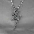 Vintage silver lightning bolt pendant necklace with lunar texture on gray silk background - Pendant + Matching Chain
