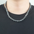 Men's dark grey beaded obsidian necklace with silver spacers worn by male model - Labradorite Beaded Style / Sodalite