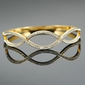 Gold plated stainless steel hollow wave bangle with sparkling pavé cubic zirconia - Gold