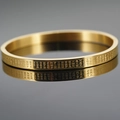 Stainless steel gold plated cuff bangle featuring engraved Heart Sutra scripture pattern - Gold