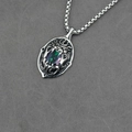 Vintage lion head pendant necklace with iridescent gemstone on textured fabric - Pendant + Matching Chain