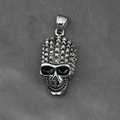 Punk style silver skull pendant with spiked top and deep eye sockets on textured fabric - Pendant Only (No Chain)