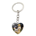 Détail du porte-clés pendentif cœur argenté avec un chiot fantaisie et collier doré - Chien