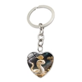 Détail du porte-clés en forme de cœur avec une illustration de serpent du zodiaque mignon - Serpent