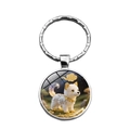 Détail d'un porte-clés rond en argent avec une illustration 3D d'un chien blanc artistique - Signe du Zodiaque Chinois Chien