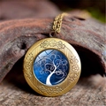 Macro shot of bronze Tree of Life locket with intricate floral carving on textured wood - Dark Blue Contrast Streamline Style (XHXL0011)