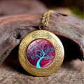 Detailed macro of vintage bronze Tree of Life locket pendant on natural wood background - Green Red Background Style (XHXL0006)