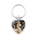 Silver heart keychain with cartoon snake zodiac illustration and gold cloud details - Snake (XSWX9284-6)