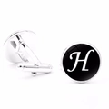 Detailed view of silver letter H cufflinks with bullet back closure on white background - Letter H