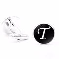 Detail showing polished silver cufflinks with black face and elegant white letter T design - Letter T