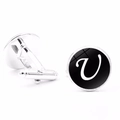 Detail view of silver men's cufflinks featuring a black polished surface and letter V - Letter U