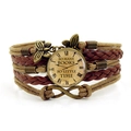 Macro shot of multilayer leather bracelet with clock pendant and infinity charm detail - Brown