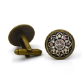 Vintage bronze cufflinks featuring colorful Buddhist mandala symbols on black background - Antique Bronze