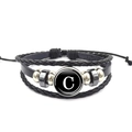 Detail of multi-layer woven leather bracelet featuring a glass cabochon with letter C - Letter C (XSWX0183-C)