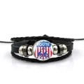 Macro shot of Route 66 glass dome charm on a layered black leather woven bracelet - Star Spangled Banner Background Style (ABXL369-2)
