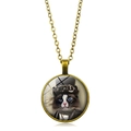 Macro detail of steampunk cat pendant with bronze chain and vintage glass cabochon - Bronze