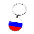 Detail of silver metal keychain with glass dome featuring the Russian flag design - Russia (ABXL1536)