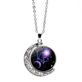Macro detail of rotating Libra constellation pendant with silver hollowed moon base - Libra