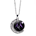 Detailed macro of Gemini zodiac moon pendant with rotating galaxy pattern on silver chain - Gemini
