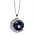 Close-up of silver Capricornus necklace featuring a glowing crescent moon and star pendant - Capricorn