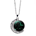 Detail of rotating crescent moon pendant with glowing Sagittarius zodiac glass cabochon - Sagittarius
