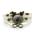 Multilayer Wicca black cat bracelet with infinity charm and butterfly bronze accents - White