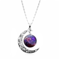 Macro shot of silver crescent moon necklace featuring a purple Cancer zodiac glass gem - Cancer