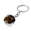Detail of double-sided glass ball keychain with Leo zodiac constellation design - Leo