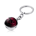 Detail of silver Virgo zodiac keychain with a double-sided red nebula crystal ball - Virgo