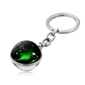 Detail of Aries zodiac keychain with green nebula glass ball and silver metal chain - Aries