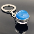 Close-up of galaxy keychain with silver metal ring and blue Neptune glass pendant - Neptune (PSXL001134-3)