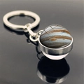 Macro view of Jupiter planet glass ball keychain with polished silver metal link and ring - Jupiter