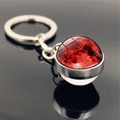 Detailed view of solar system keychain with red moon pattern on reflective black background - Red Moon (PSXL001135-11)