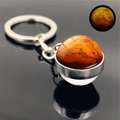 Macro shot of luminous Mars planet glass ball keychain with glowing effect in the dark - Mars (PSXL001205-1)