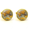 Detail of round golden French cufflinks featuring a vintage world map under glass - Gold