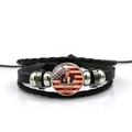 Detailed macro of the woven leather bracelet featuring Uncle Sam and US flag glass charm - Uncle Sam Inspirational Quote Style (PSXL001195-6)