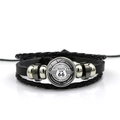 Macro detail of the Route 66 glass gem on a multilayer leather woven bracelet - Road Trip Eight States Style (PSXL001195-13)