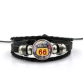 Macro shot of Route 66 glass cabochon on a multi-layer black leather woven bracelet - Time Gem Route 66 Style (PSXL001195-18)