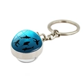 Silver marine keychain featuring a round glass orb with black shark silhouettes on blue - Shark Silhouette Pattern (PSXL001187-5)