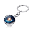 Macro shot of double-sided glass ball keychain with universe galaxy nebula design - Minimalist Nebula Style (PSXL001467-8)