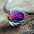 Macro shot of double-sided glass galaxy pendant necklace with cosmic nebula pattern - Red Blue Nebula Style (XSWX0941-4)
