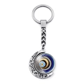 Détail d'un porte-clés lune en métal argenté avec un œil protecteur bleu rotatif unique - Motif 11 (XSWX4298-11)