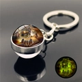 Luminous wolf dreamcatcher glass ball keychain with green glowing effect in the dark - Wolf Profile Pattern 8 (XSWX2471-8)