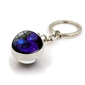 Detail of silver Aquarius zodiac keychain with a glowing blue purple cosmic glass ball - Aquarius