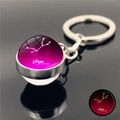 Luminous Virgo zodiac keychain with a glowing pink glass ball and silver metal frame - Virgo
