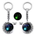 Luminous Taurus zodiac keychain with double-sided rotating moon pendant in silver finish - Taurus