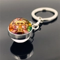Gemini zodiac keychain featuring double-sided crystal glass ball with silver metal ring - Gemini