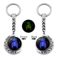 Detailed front and back view of glow-in-the-dark Scorpio constellation moon keychain - Scorpio