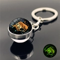 Porte-clés Taureau lumineux avec boule de cristal double face et anneau métallique - Taureau